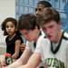 Huron coach Marcus Edmondson's daughter Saige, five, listens in the locker room during halftime of the game against Pickney on Monday, March 4. Daniel Brenner I AnnArbor.com
